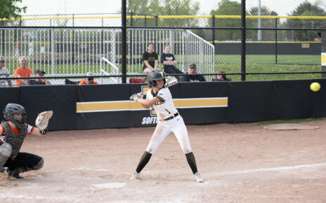 Cydnee Wolford preparing to hit the ball into left field against New Lexington