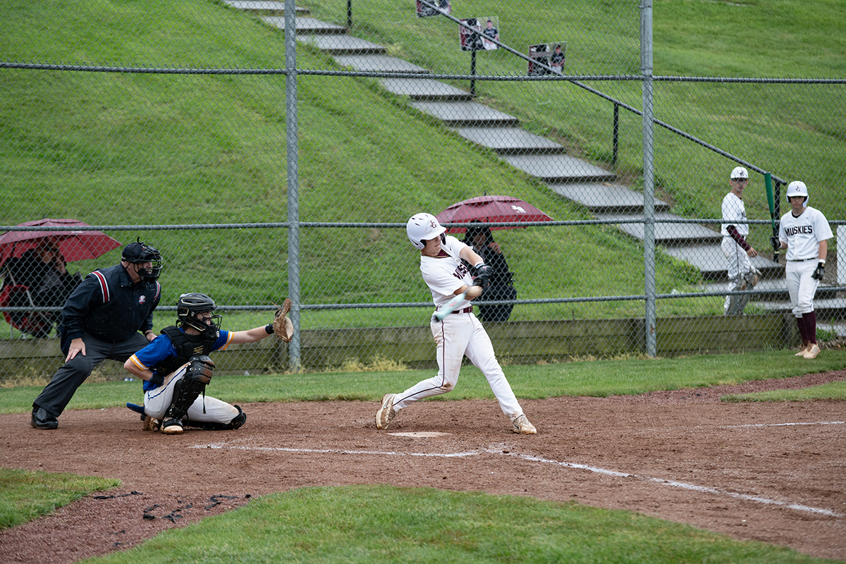 The Lil' Muskies Justin Stambush swinging at a fast pitch from Maysville