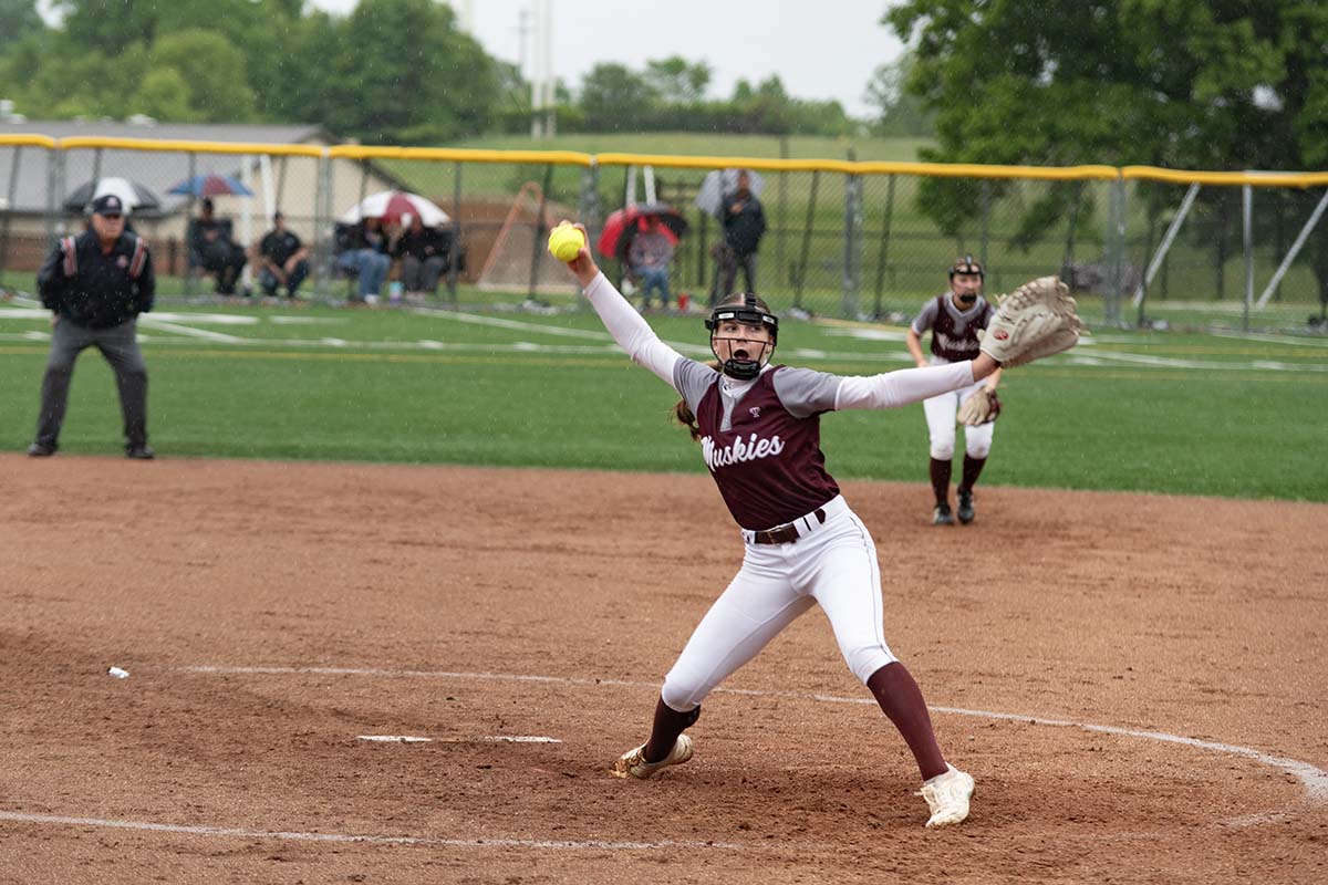 John Glenn's Kendall Snider finishing the wind-up for a pitch against Morgan