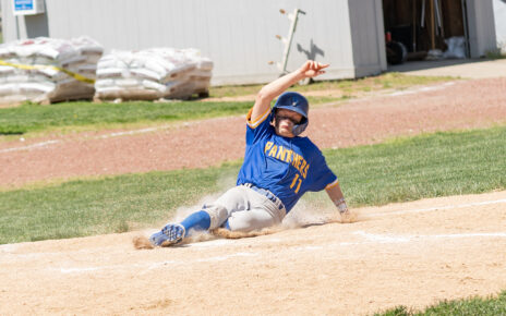 Bryce Fisher slid into home base as he scored a run for Maysville against Bishop Rosecrans