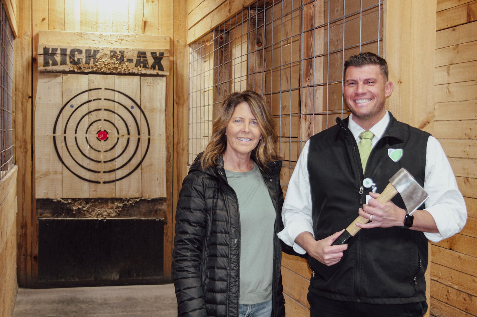 Dee Luburgh of Kick-N-Ax and Taylor Russell of Shrivers Hospice Foundation pictured in front of one of the throwing lanes at Kick-N-Ax, the location for the Axe Madness event.