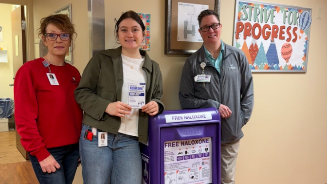 Monica Doan, Julia Zalmanek, and Stacy Highley pictured with one of the new Barney Boxes.