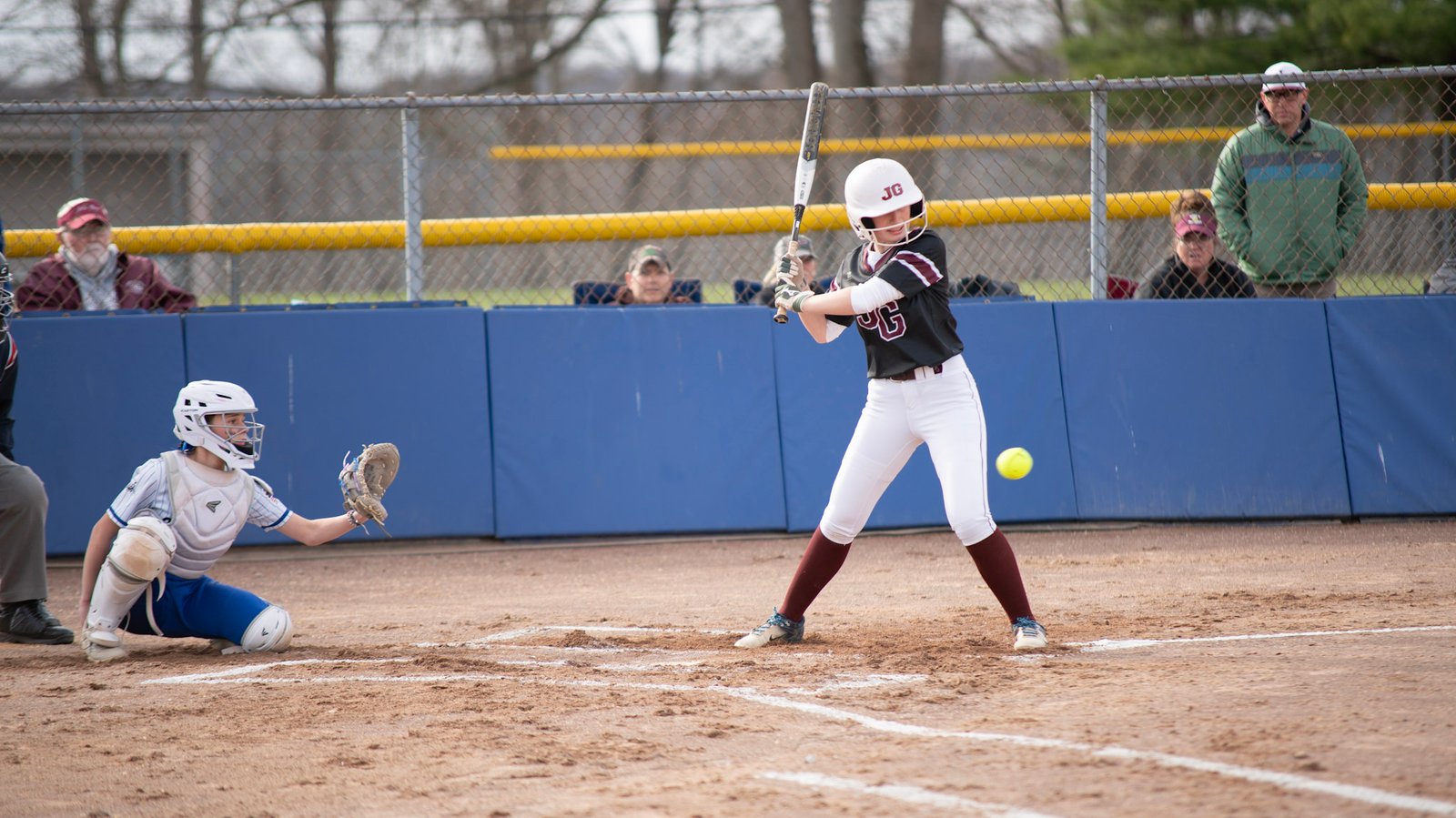 John Glenn softball player watches a pitch that falls out of the strike zone against Cambridge