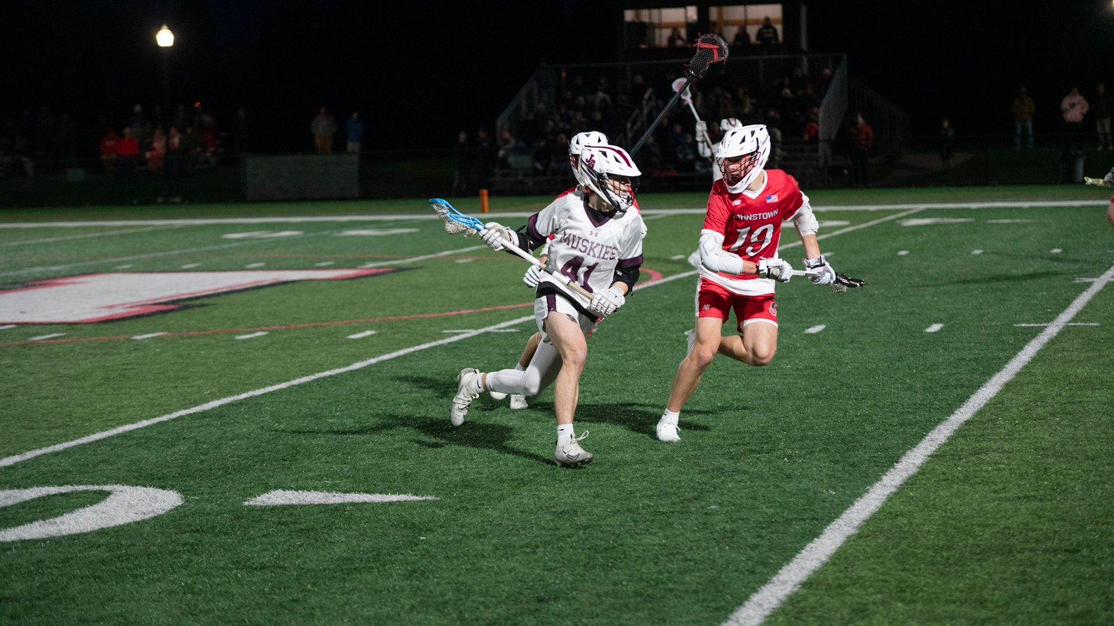 Freshman Brady Hayes carries the ball downfield for the Lil' Muskies