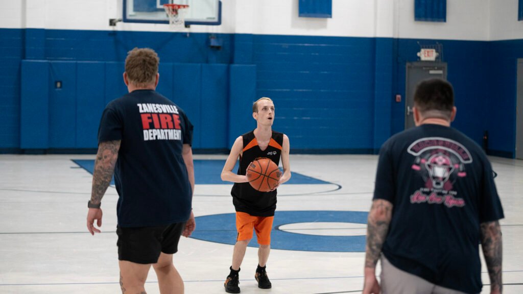 Tigers Brandon Riley aimed for a three pointer in the Zanesville Fire Dept game