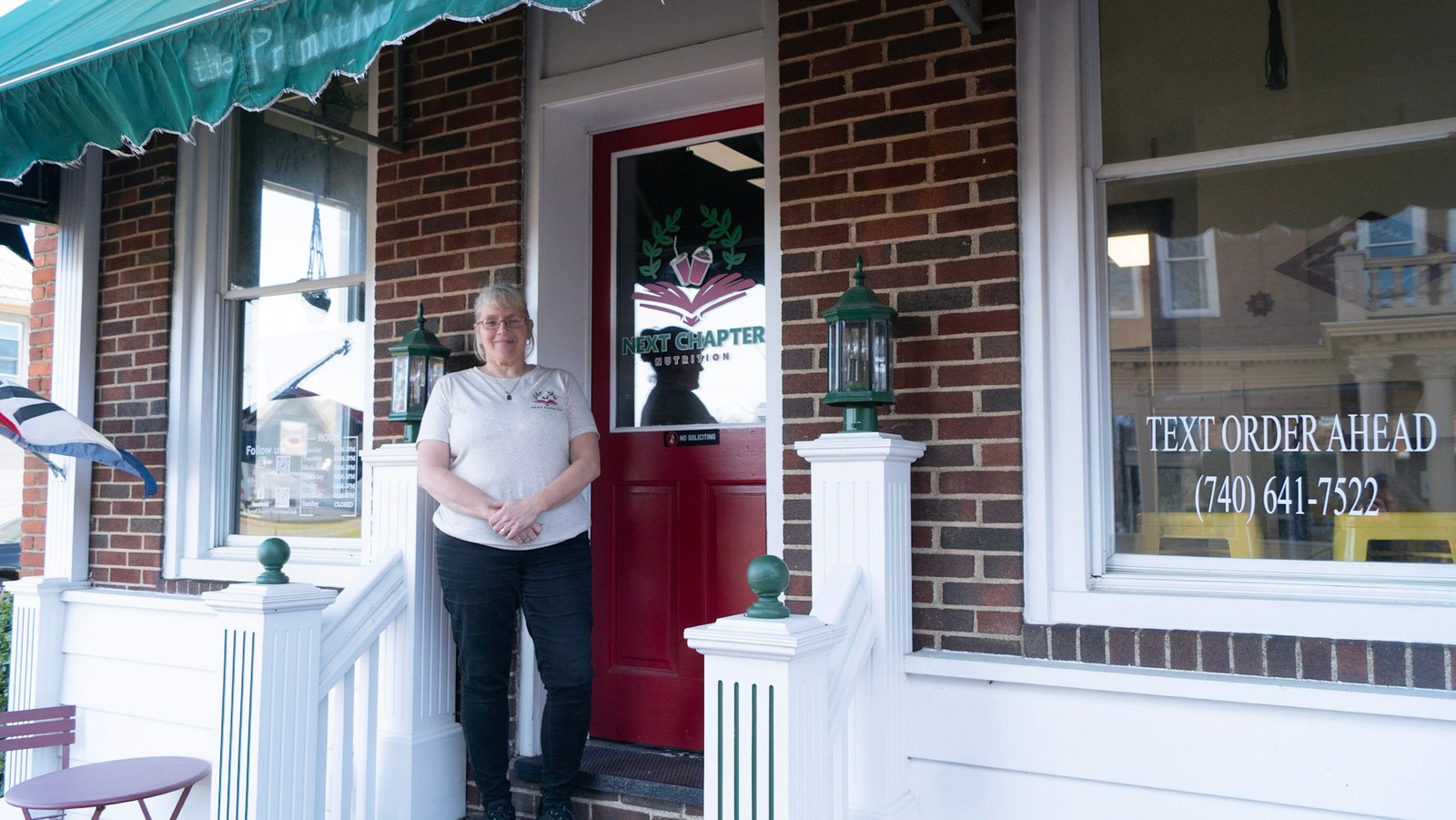 Next Chapter Nutrition owner Connie LeMaster stands at the entrance of her Nutrition Club.